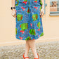 Blauer Midirock mit Muster und Schleifen an den Taschen
