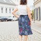Blau-roter Midirock mit Schleifen an den Taschen